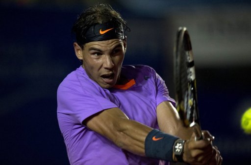 Rafael Nadal hits a return to Martin Alund of Argentina during the Mexico ATP Open in Acapulco on February 27, 2013 Rafael Nadal hits a return to Martin Alund of Argentina during the Mexico ATP Open in Acapulco on February 27, 2013