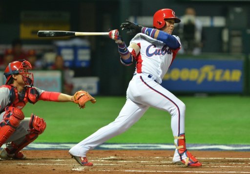 Jose Fernandez bats as China's catcher Meng Weiqiang looks on during their match in Fukuoka on March 4, 2013 Jose Fernandez bats as China's catcher Meng Weiqiang looks on during their match in Fukuoka on March 4, 2013