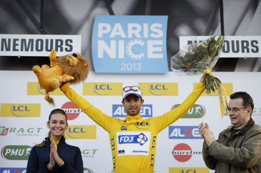Nacer Bouhanni celebrates with his overall leader yellow jersey on the podium on March 4, 2013 Nacer Bouhanni celebrates with his overall leader yellow jersey on the podium on March 4, 2013