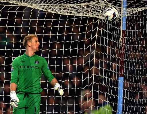 Manchester City goalkeeper Joe Hart eyes the ball over the net in Birmingham on March 4, 2013 Manchester City goalkeeper Joe Hart eyes the ball over the net in Birmingham on March 4, 2013