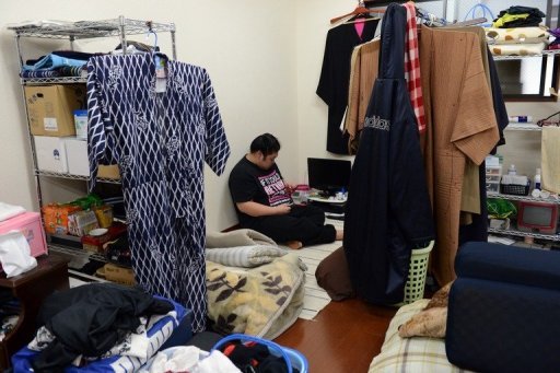 Sumo wrestler Genkaiho relaxes in his private space after training at a sumo stable in Tokyo on February 14, 2013 Sumo wrestler Genkaiho relaxes in his private space after training at a sumo stable in Tokyo on February 14, 2013
