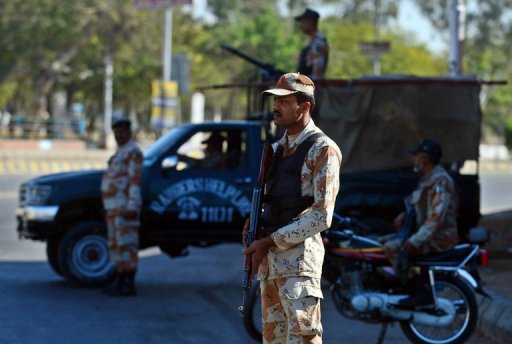Pakistani paramilitary soldiers stand guard in Karachi on March 4, 2013, the day following a car bomb attack in the city Pakistani paramilitary soldiers stand guard in Karachi on March 4, 2013, the day following a car bomb attack in the city