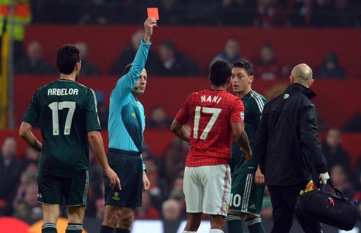 Cuneyt Cakir shows Nani the red card during the UEFA Champions League clash at Old Trafford on March 5, 2013 Cuneyt Cakir shows Nani the red card during the UEFA Champions League clash at Old Trafford on March 5, 2013