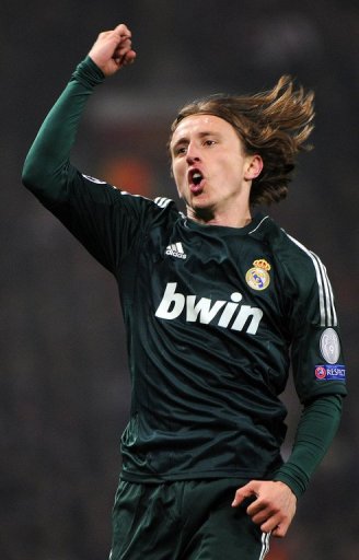 Real Madrid midfielder Luka Modric celebrates scoring the equaliser against Manchester United on March 5, 2013 Real Madrid midfielder Luka Modric celebrates scoring the equaliser against Manchester United on March 5, 2013