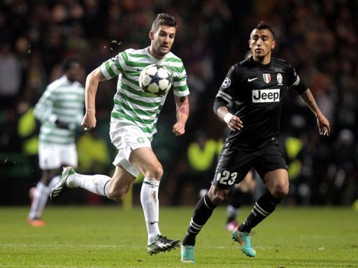 Celtic's Charlie Mulgrew (L) vies with Arturo Vidal of Juventus during the first leg at Celtic Park on February 12, 2013 Celtic's Charlie Mulgrew (L) vies with Arturo Vidal of Juventus during the first leg at Celtic Park on February 12, 2013
