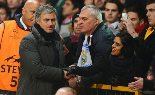 Real Madrid's manager Jose Mourinho (L) is greeted by fans as he leaves the pitch at Old Trafford on March 5, 2013 Real Madrid's manager Jose Mourinho (L) is greeted by fans as he leaves the pitch at Old Trafford on March 5, 2013