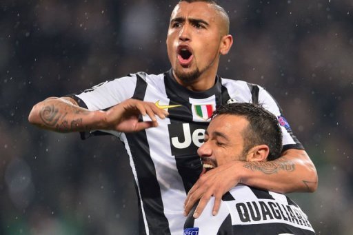 Juventus' Fabio Quagliarella (R) celebrates with teammate Arturo Vidal on March 6, 2013 at the Juventus' Fabio Quagliarella (R) celebrates with teammate Arturo Vidal on March 6, 2013 at the