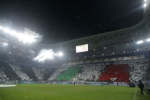 Supporters wave flags under an heavy rain prior to the match on March 6, 2013 at the Supporters wave flags under an heavy rain prior to the match on March 6, 2013 at the