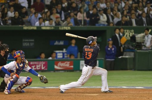 Japan's outfielder Sho Nakata (R) bats a timely sacrifice fly against Taiwan on March 8, 2013 Japan's outfielder Sho Nakata (R) bats a timely sacrifice fly against Taiwan on March 8, 2013