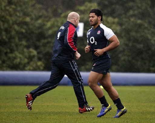 England's prop Dan Cole (L) and England's centre Manu Tuilagi (R) warm up at the team's training base, March 8, 2013 England's prop Dan Cole (L) and England's centre Manu Tuilagi (R) warm up at the team's training base, March 8, 2013