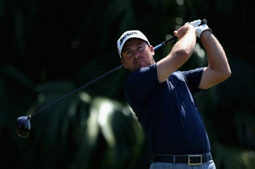 Graeme McDowell of Northern Ireland tees off on the 12th hole on March 8, 2013 in Doral, Florida Graeme McDowell of Northern Ireland tees off on the 12th hole on March 8, 2013 in Doral, Florida