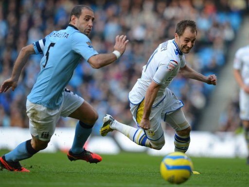 Manchester City defender Pablo Zabaleta (L) chases Leeds United's Luke Varney in the FA Cup on February 17, 2013 Manchester City defender Pablo Zabaleta (L) chases Leeds United's Luke Varney in the FA Cup on February 17, 2013