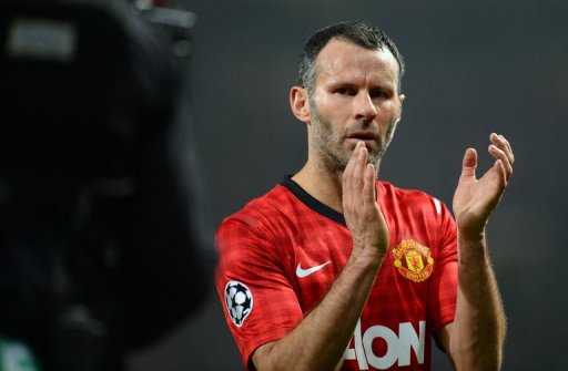 Manchester United midfielder Ryan Giggs applauds at the end of the defeat to Real Madrid on March 5, 2013 Manchester United midfielder Ryan Giggs applauds at the end of the defeat to Real Madrid on March 5, 2013