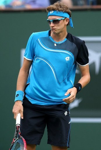Denis Istomin reacts to a shot from Roger Federer at the BNP Paribas Open at Indian Wells on March 9, 2013 Denis Istomin reacts to a shot from Roger Federer at the BNP Paribas Open at Indian Wells on March 9, 2013