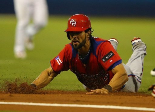 Angel Pagan of Puerto Rico is out after being tagged in a run down against Venezuela on March 9, 2013 Angel Pagan of Puerto Rico is out after being tagged in a run down against Venezuela on March 9, 2013