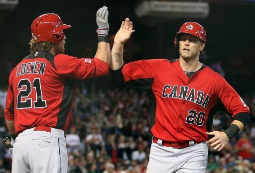 Michael Saunders (R) of Canada high-fives Adam Loewen after scoring a first-inning run against Mexico on March 9, 2013 Michael Saunders (R) of Canada high-fives Adam Loewen after scoring a first-inning run against Mexico on March 9, 2013