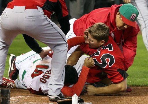 Eduardo Arredondo (L) of Mexico fights with Jay Johnson of Canada during the World Baseball Classic on March 9, 2013 Eduardo Arredondo (L) of Mexico fights with Jay Johnson of Canada during the World Baseball Classic on March 9, 2013