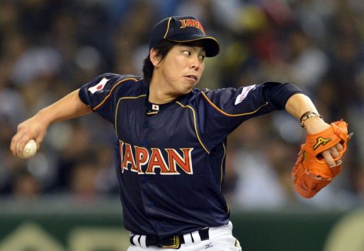 Japan's starting pitcher Kenta Maeda throws the ball against the Netherlands at Tokyo Dome on March 10, 2013 Japan's starting pitcher Kenta Maeda throws the ball against the Netherlands at Tokyo Dome on March 10, 2013