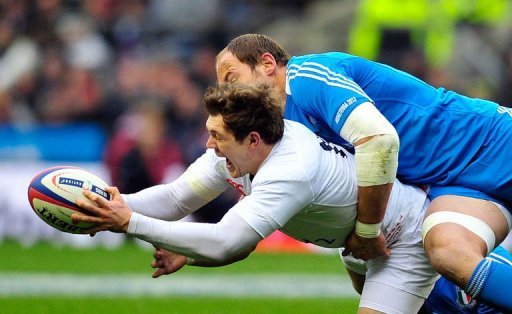 England's Alex Goode (L) is tackled by Italy's Sergio Parisse at Twickenham on March 10, 2013 England's Alex Goode (L) is tackled by Italy's Sergio Parisse at Twickenham on March 10, 2013