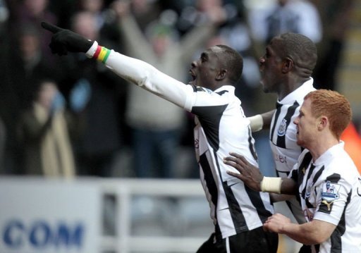 Newcastle's Papiss Cisse (L) celebrates scoring the winning goal at St James' Park on March 10, 201 Newcastle's Papiss Cisse (L) celebrates scoring the winning goal at St James' Park on March 10, 201