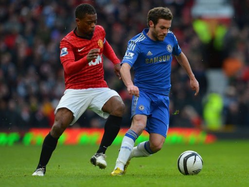 Manchester United's Patrice Evra (L) vies with Chelsea's Juan Mata at Old Trafford, on March 10, 2013 Manchester United's Patrice Evra (L) vies with Chelsea's Juan Mata at Old Trafford, on March 10, 2013