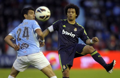 Celta's Augusto Fernandez (L) vies with Real Madrid's Marcelo in Vigo, on March 10, 2013 Celta's Augusto Fernandez (L) vies with Real Madrid's Marcelo in Vigo, on March 10, 2013