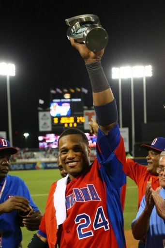 Robinson Cano of the Dominican Republic holds the MVP trophy after defeating Puerto Rico at the WBC on March 10, 2013 Robinson Cano of the Dominican Republic holds the MVP trophy after defeating Puerto Rico at the WBC on March 10, 2013