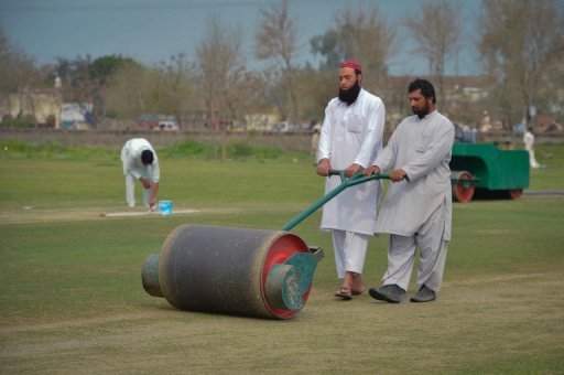 Ground staff prepare a pitch in northwest Swabi, the hometown of a Pakistani cricketer Fawad Ahmed on March 9, 2013. Ground staff prepare a pitch in northwest Swabi, the hometown of a Pakistani cricketer Fawad Ahmed on March 9, 2013.