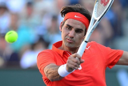 Roger Federer returns against Ivan Dodig at Indian Wells on March 11, 2013 Roger Federer returns against Ivan Dodig at Indian Wells on March 11, 2013