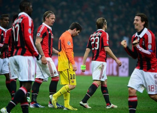 Barcelona forward Lionel Messi (C) cuts a dejected figure in the 2-0 defeat at AC Milan on February 20, 2013 Barcelona forward Lionel Messi (C) cuts a dejected figure in the 2-0 defeat at AC Milan on February 20, 2013