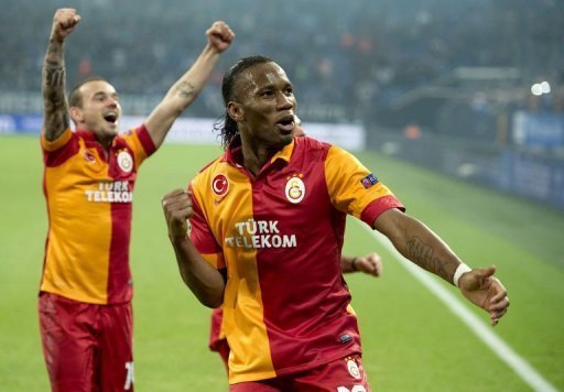 Galatasaray's Didier Drogba (R) and Wesley Sneijder celebrate beating Schalke on March 12, 2013 Galatasaray's Didier Drogba (R) and Wesley Sneijder celebrate beating Schalke on March 12, 2013
