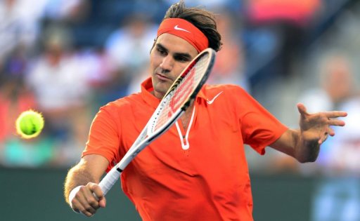 Roger Federer hits a backhand return against Stanislas Wawrinka at the BNP Paribas Open on March 13, 2013 Roger Federer hits a backhand return against Stanislas Wawrinka at the BNP Paribas Open on March 13, 2013