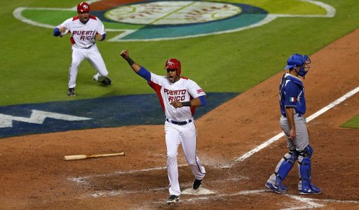 Alex Rios celebrates scoring the game-winning run against Italy on March 13, 2013 Alex Rios celebrates scoring the game-winning run against Italy on March 13, 2013