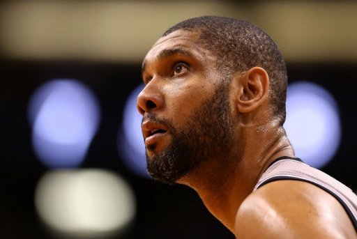 Tim Duncan, pictured last month, finished with 28 points and 19 rebounds as the Spurs clinched a playoff spot Thursday Tim Duncan, pictured last month, finished with 28 points and 19 rebounds as the Spurs clinched a playoff spot Thursday
