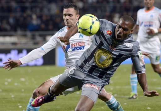 Marseille's defender Jeremy Morel (L) vies with Ajaccio's midfielder Carl Medjani on March 15, 2013 Marseille's defender Jeremy Morel (L) vies with Ajaccio's midfielder Carl Medjani on March 15, 2013