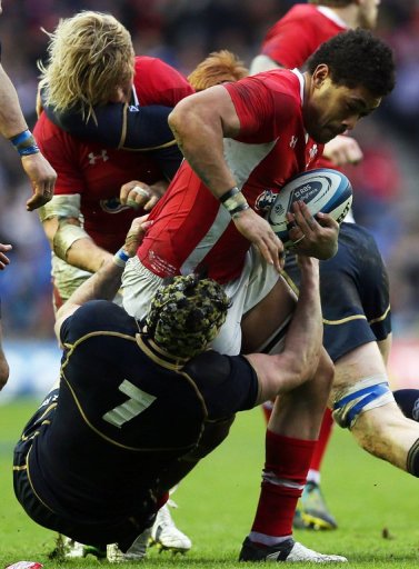 Wales's Toby Faletau (R) is tackled by Scotland's Kelly Brown (L), in Edinburgh, on March 9, 2013 Wales's Toby Faletau (R) is tackled by Scotland's Kelly Brown (L), in Edinburgh, on March 9, 2013