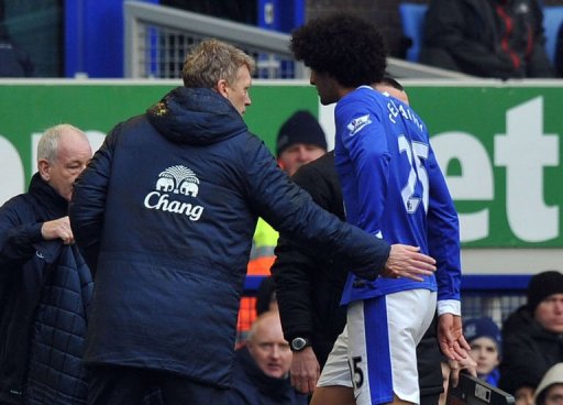Everton manager David Moyes greets Marouane Fellaini during the match against Wigan Athletic in Liverpool March 9, 2013 Everton manager David Moyes greets Marouane Fellaini during the match against Wigan Athletic in Liverpool March 9, 2013
