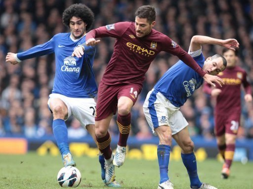 Marouane Fellaini (L) and Leon Osman tackle Javier Garcia (C) in Liverpool on March 16, 2013 Marouane Fellaini (L) and Leon Osman tackle Javier Garcia (C) in Liverpool on March 16, 2013