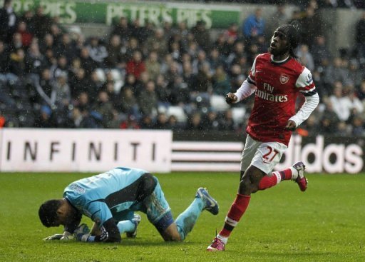 Arsenal's striker Gervinho (R) celebrates scoring a goal at The Liberty Stadium in Swansea, Wales, on March 16, 2013 Arsenal's striker Gervinho (R) celebrates scoring a goal at The Liberty Stadium in Swansea, Wales, on March 16, 2013