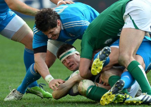 Ireland's centre Brian O'Driscoll is tackled by Italy's flanker Alessandro Zanni (L) in Rome on March 16, 2013 Ireland's centre Brian O'Driscoll is tackled by Italy's flanker Alessandro Zanni (L) in Rome on March 16, 2013