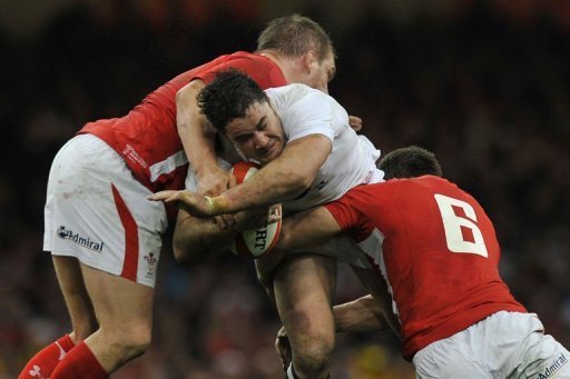 England's Brad Barritt (C) is tackled by Wales' players during their Six Nations match in Cardiff on March 16, 2013 England's Brad Barritt (C) is tackled by Wales' players during their Six Nations match in Cardiff on March 16, 2013