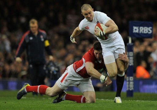 England's wing Mike Brown (R) is tackled in Cardiff, on March 16, 2013 England's wing Mike Brown (R) is tackled in Cardiff, on March 16, 2013