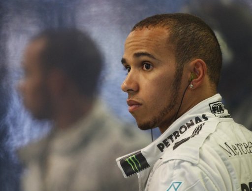 Lewis Hamilton is pictured in his garage during the qualifying session for the Australian Grand Prix on March 16, 2013 Lewis Hamilton is pictured in his garage during the qualifying session for the Australian Grand Prix on March 16, 2013