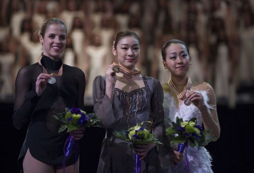 Carolina Kostner (L), Kim Yu-na (C) and Mao Asada at the World Figure Skating Championships on March 16, 2013 Carolina Kostner (L), Kim Yu-na (C) and Mao Asada at the World Figure Skating Championships on March 16, 2013