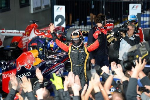 Kimi Raikkonen celebrates winning the season-opening Australian Formula One GP, in Melbourne, on March 17, 2013 Kimi Raikkonen celebrates winning the season-opening Australian Formula One GP, in Melbourne, on March 17, 2013