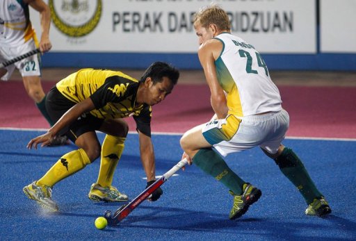 Faizal Saari (left) fights for the ball with Christopher Bausor in Ipoh on March 17, 2013. Faizal Saari (left) fights for the ball with Christopher Bausor in Ipoh on March 17, 2013.