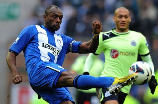 Wigan's Emmerson Boyce (L) clears the ball away from Newcastle's Yoan Gouffran in Wigan on March 17, 2013 Wigan's Emmerson Boyce (L) clears the ball away from Newcastle's Yoan Gouffran in Wigan on March 17, 2013