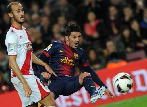 Barcelona's David Villa (R) and Rayo's Alex Galvez are pictured during their Spanish league match on March 17, 2013 Barcelona's David Villa (R) and Rayo's Alex Galvez are pictured during their Spanish league match on March 17, 2013