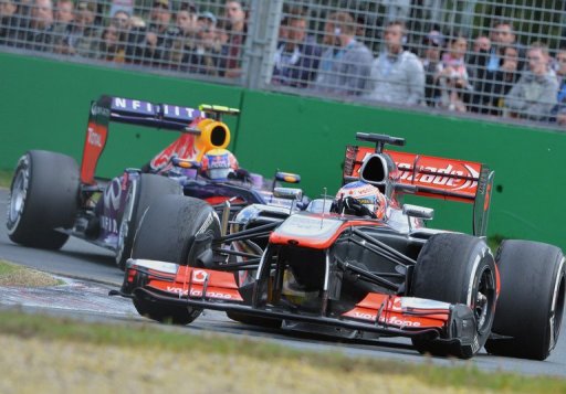 McLaren's Jenson Button powers ahead of Mark Webber during the Australian Grand Prix on March 17, 2013 McLaren's Jenson Button powers ahead of Mark Webber during the Australian Grand Prix on March 17, 2013