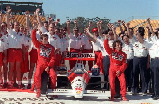 Brazilian Ayrton Senna (L) raises his fist along with his team-mate Alain Prost (R), on November 12, 1988 Brazilian Ayrton Senna (L) raises his fist along with his team-mate Alain Prost (R), on November 12, 1988